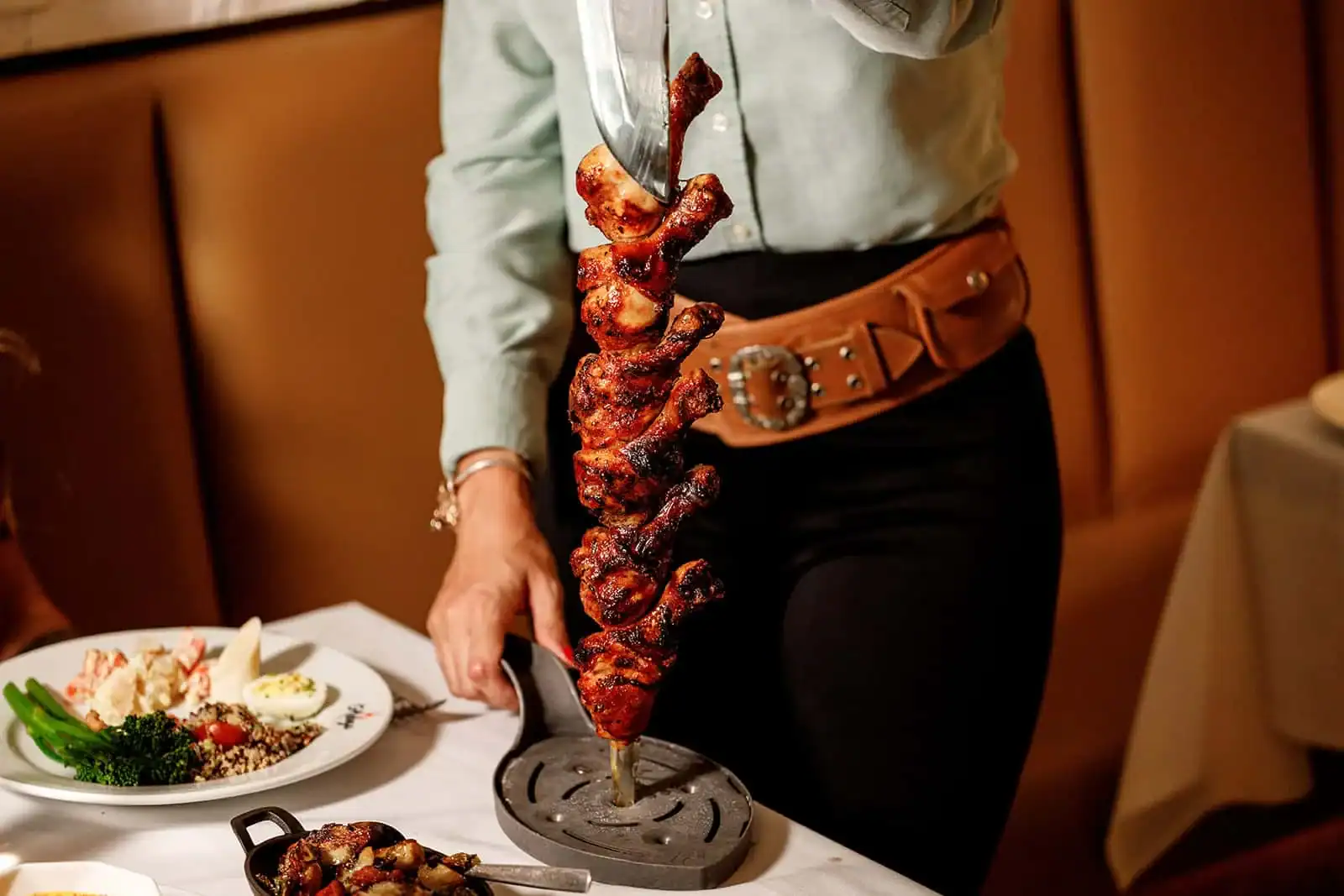 Guests enjoying churrasco at Adega Gaucha near Pompano Beach