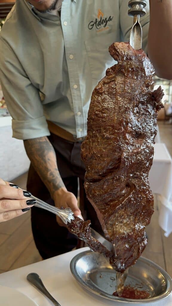 This image shows an Authentic Fraldinha Brazilian Churrasco served by expertly Gaucho's.